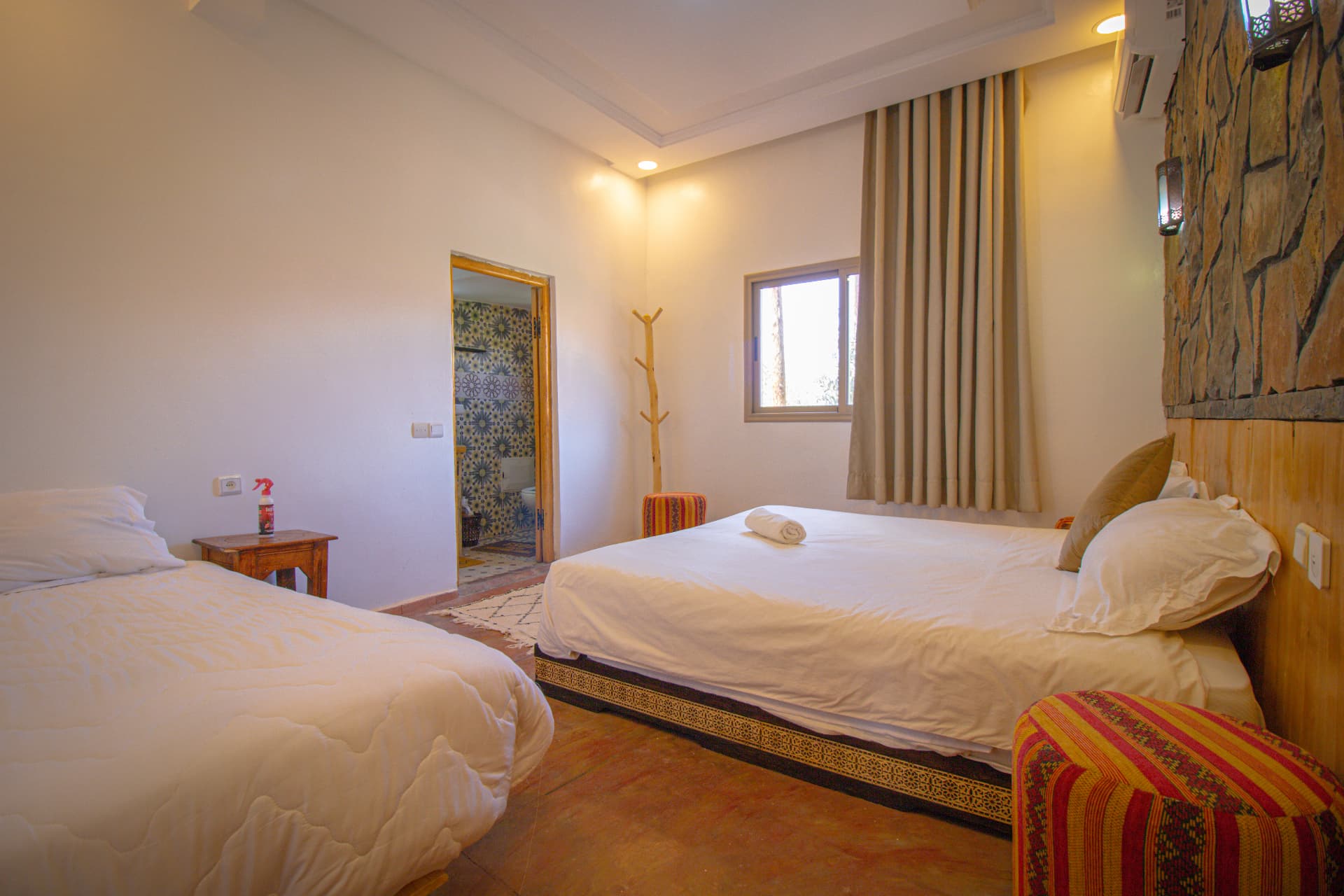 ZAGORA — double and single beds with lantern sconces and window light