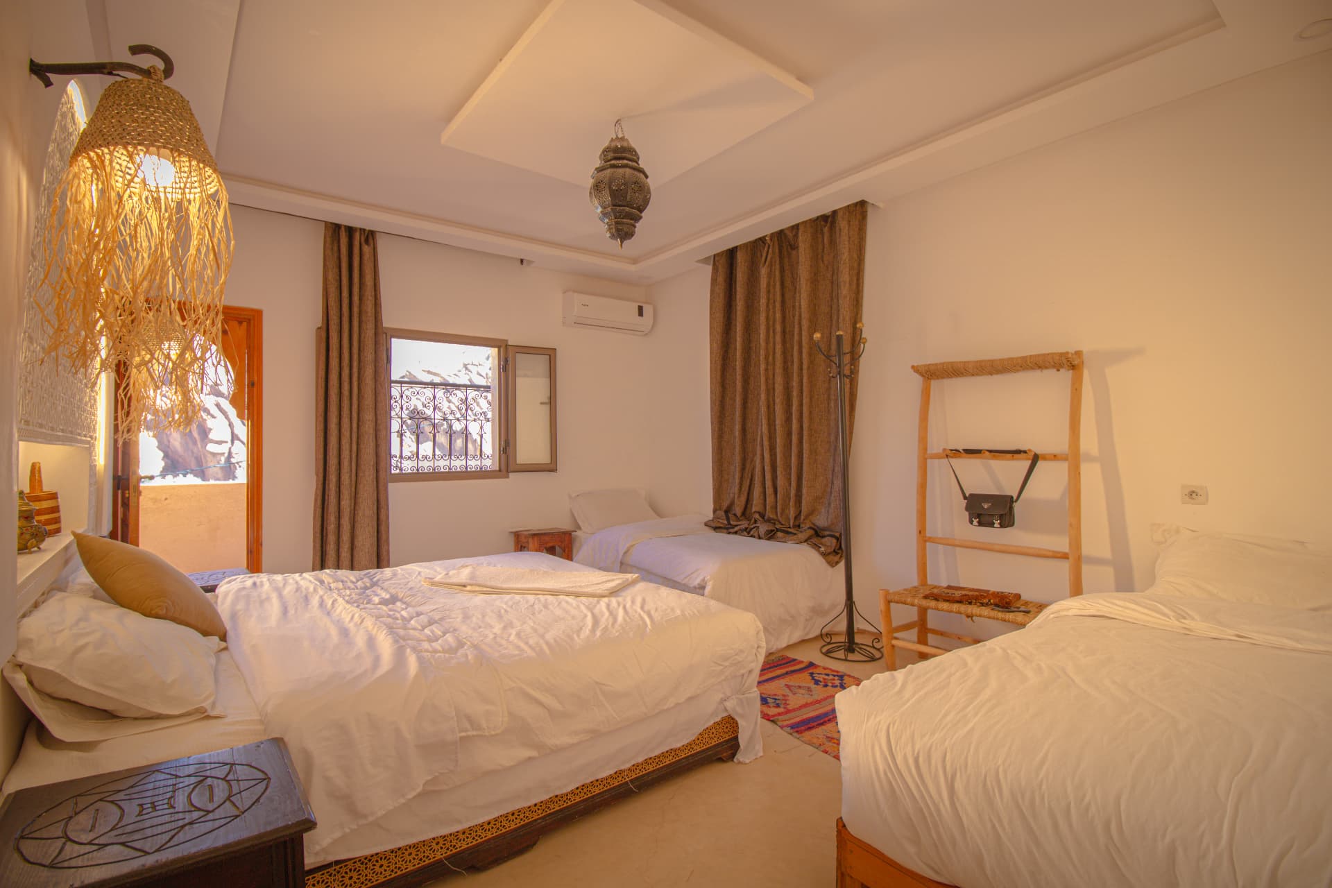 TIRIT — wide suite with double bed, two single beds and lantern light