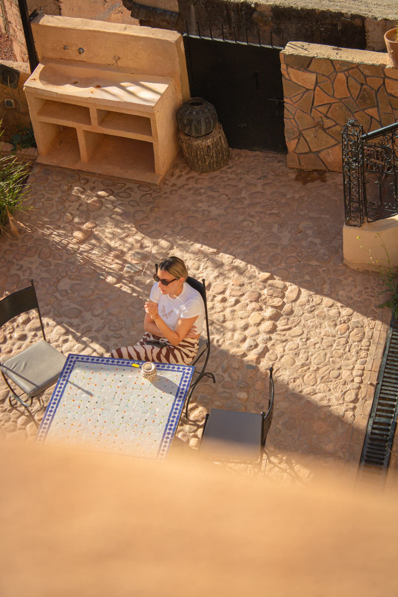 Mosaic table in the riad courtyard