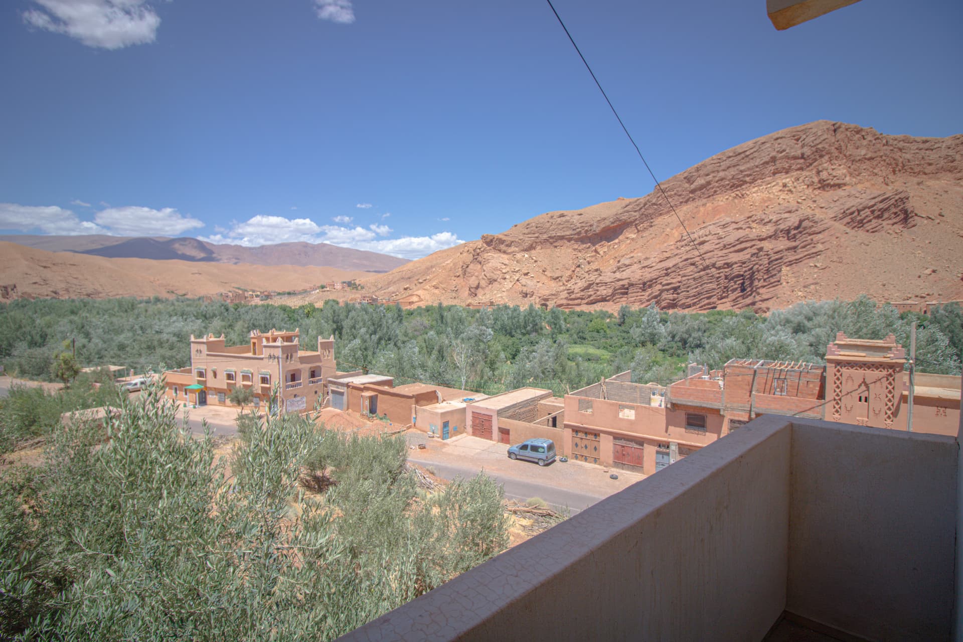 TODRA — terrace view over the village, palm groves and Dades canyon cliffs
