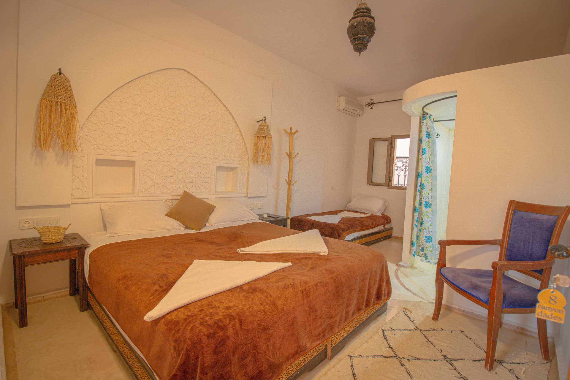 ANYA — bedroom in daylight with lantern, extra single bed and window