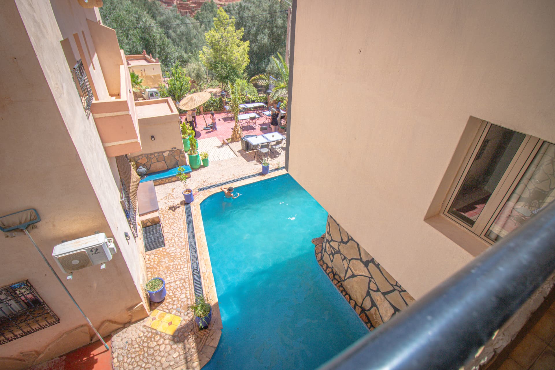 ZIZ — balcony view over the pool terrace and garden below