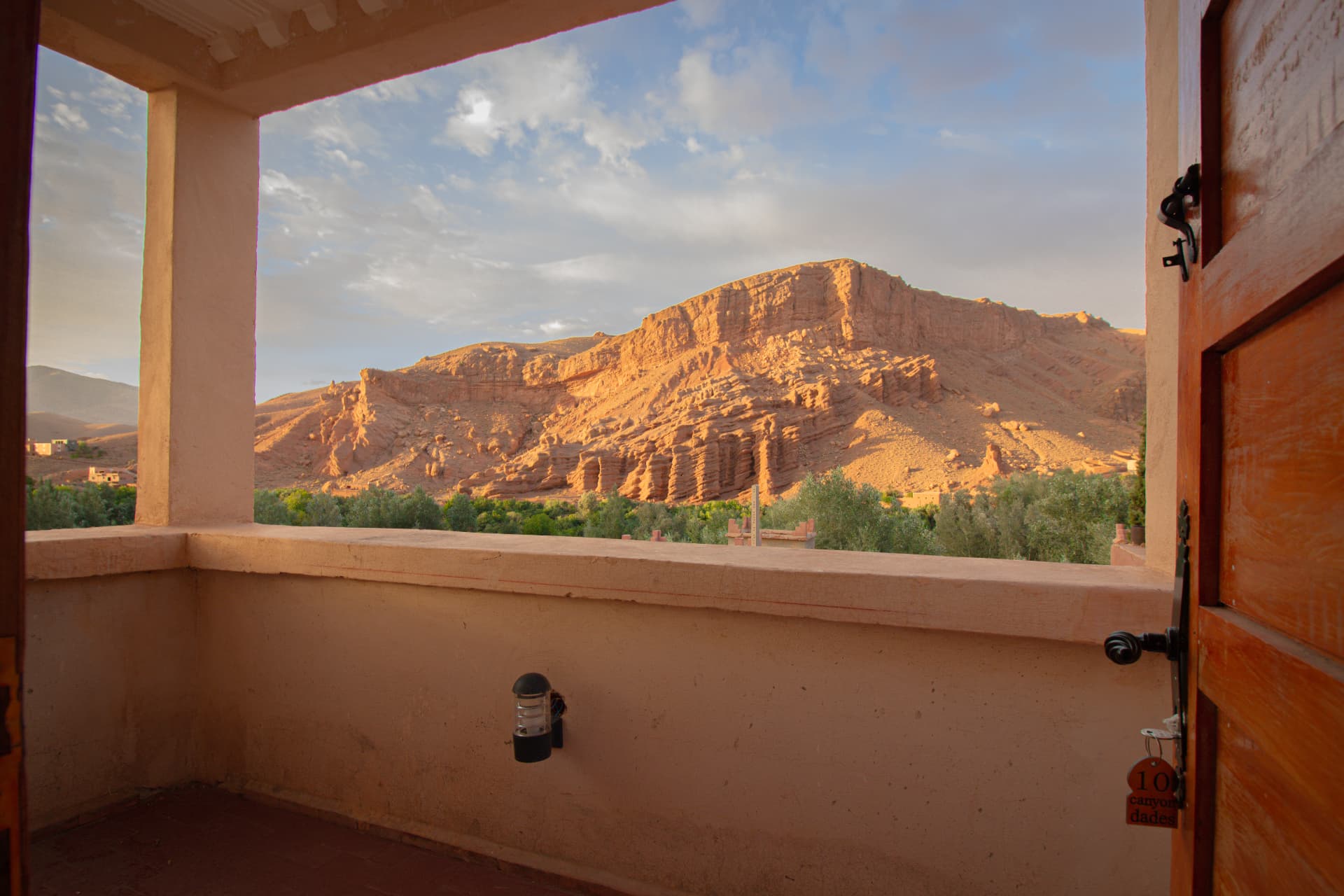 AYOUR — private terrace looking out to the red cliffs of the Dades at sunrise