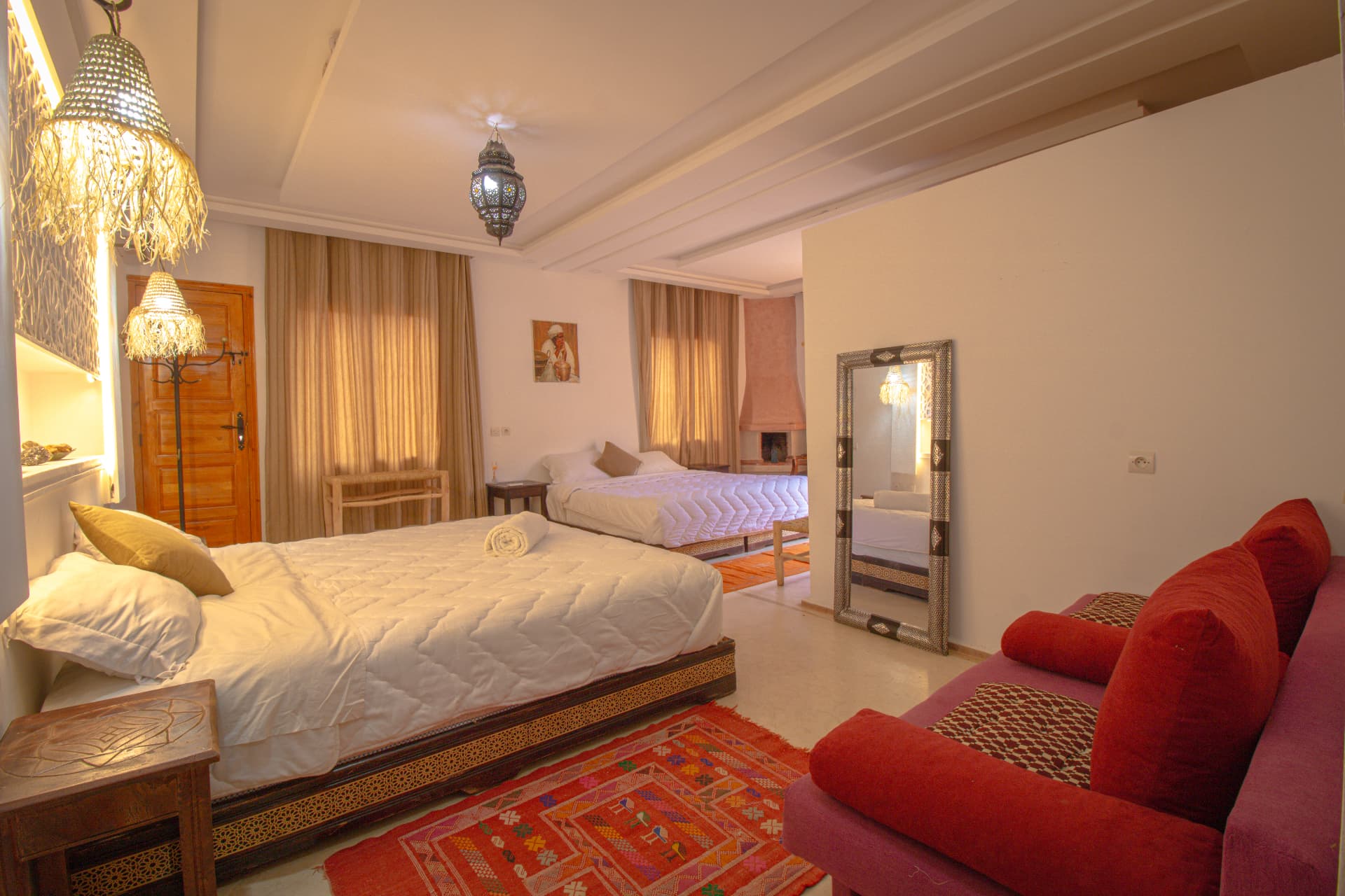 ATLAS — bedroom interior with lanterns, mirror and red sofa