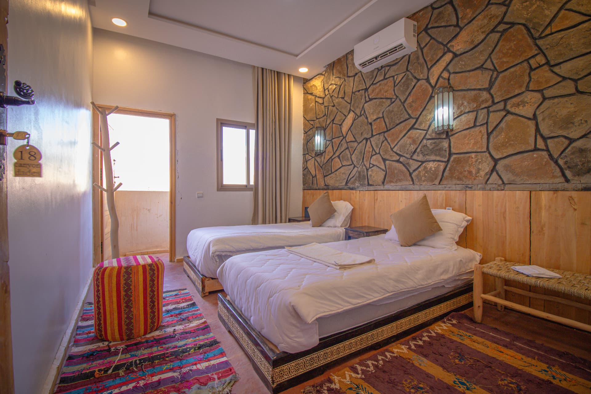 TODRA — twin beds beside the doorway to the private terrace